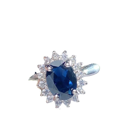 Close-up of silver ring with sapphire