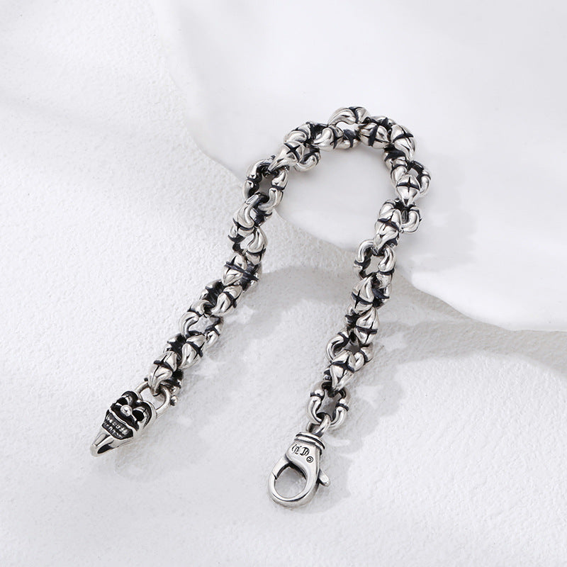 Thick sterling silver bracelet on a male wrist